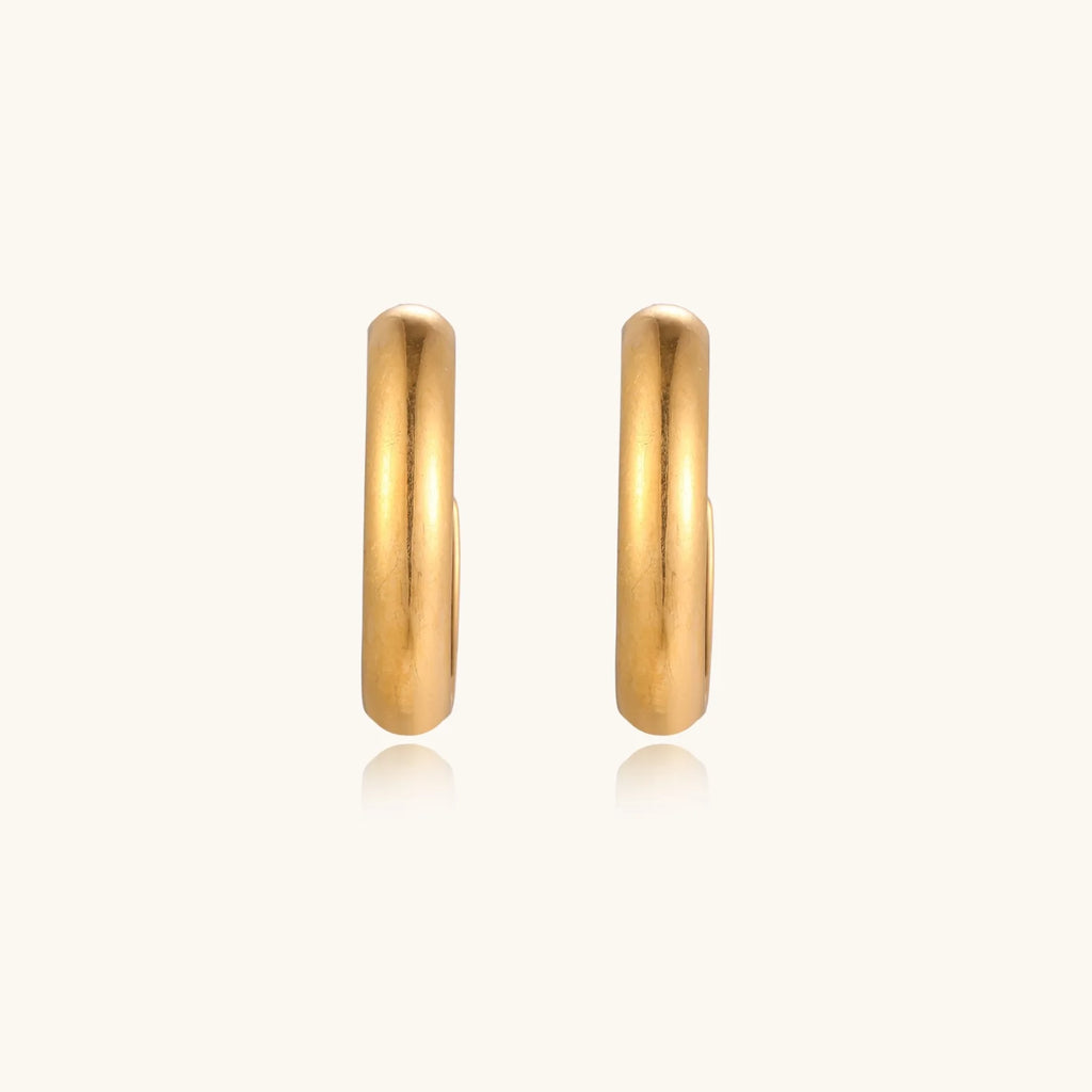 Chunky brushed gold hoop earrings in 14K plated stainless steel on cream background, front and side view.